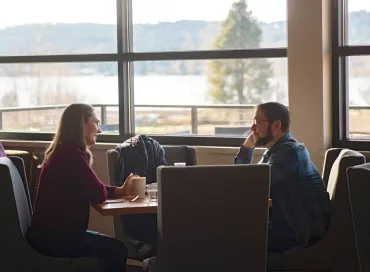 Indoor dining with water views at Maynard's